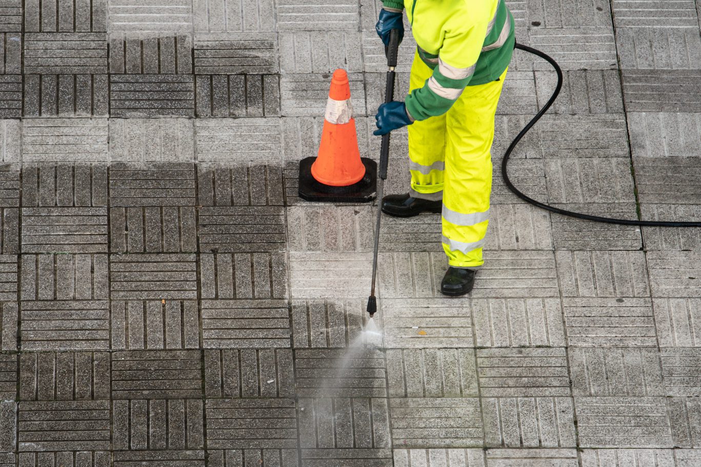 Outside worker providing commercial pressure washing company orlando.