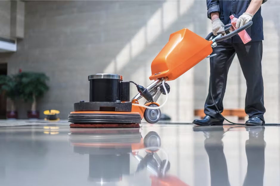 Man working on commerical flor cleaning orlando job