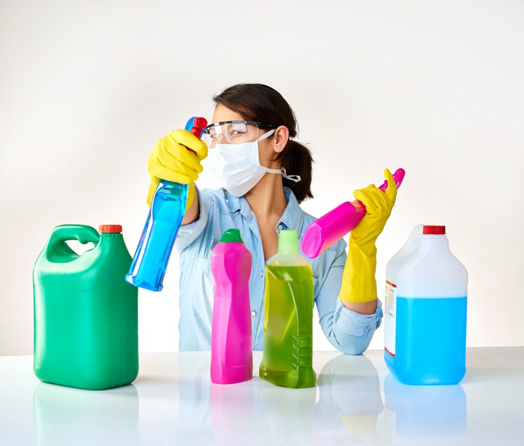 High-level disinfectants and low-level disinfectants being handled by a cleaning woman